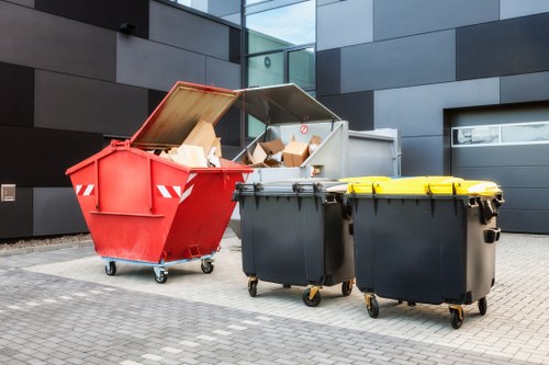 Workers sorting materials from a skip for recycling and reuse